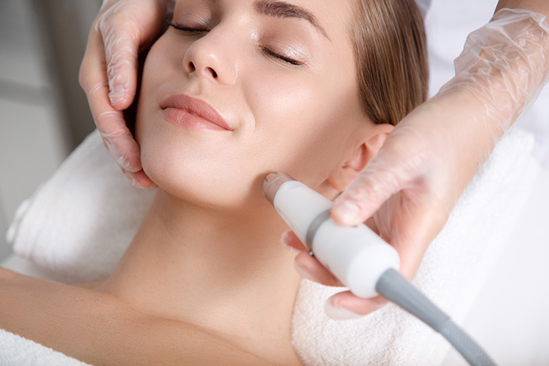 facial laser treatment woman